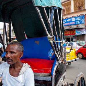 Rickshaw wallah resting