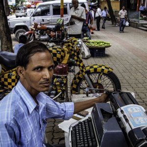 Man working with typewriter