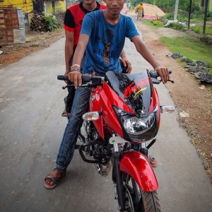 Two men on motorbike