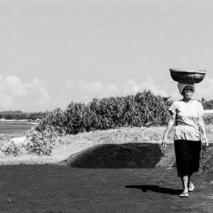 Woman carrying basket on head