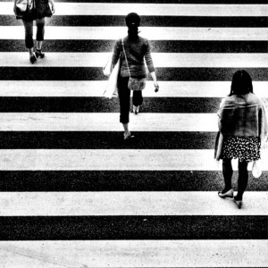 three women on pedestrian crossing