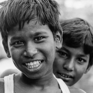 Two boys standing tandem