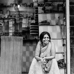 Woman smiling in storefront