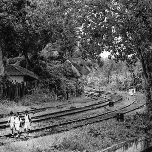 Three boys on railway track
