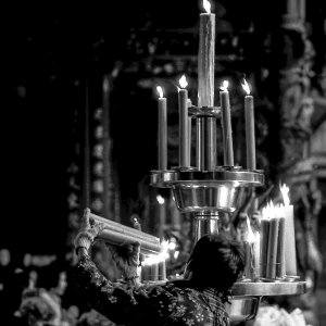 Woman lighting a candle