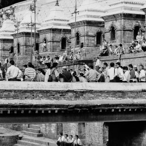 Many people gathering around river in  Pashupatinath Temple