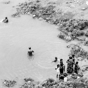 People standing in armlet of Mahananda river