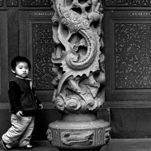 Boy beside pillar in Tzushr Temple