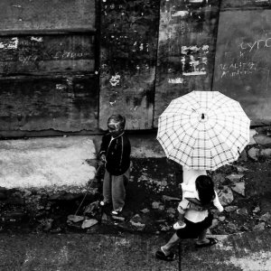 Umbrella passing by man
