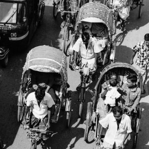 Cycle rickshaws in wide street