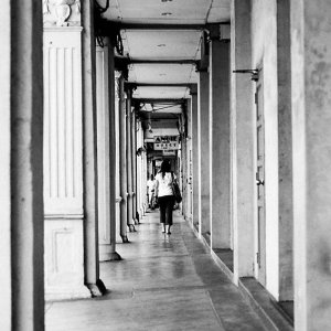 Woman walking straight passageway