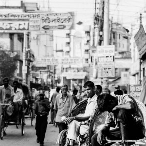 Rickshaw wallah in crowded street