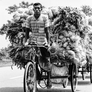 Man carrying a pile of goods