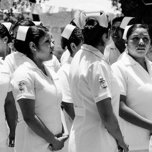 Nurses wearing a nurse's cap