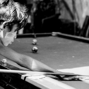 Young man holding cue stick