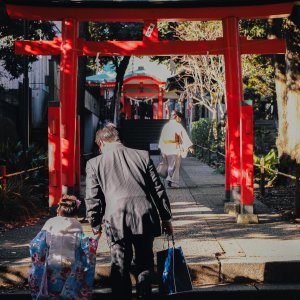 black-tied family in Shinto shrine