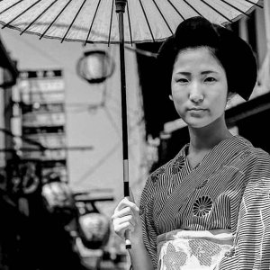 woman holding coarse oilpaper umbrella