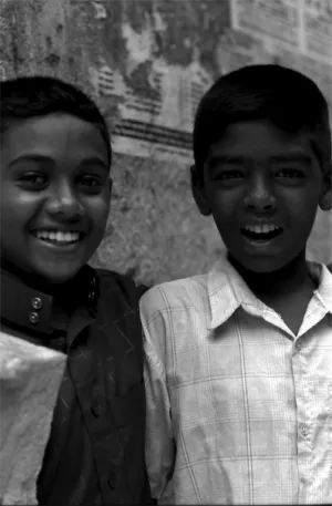 Two boys laughing in lane