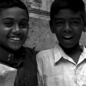 Two boys laughing in lane
