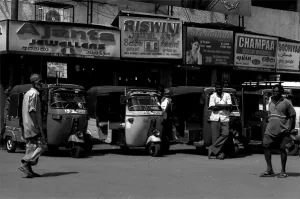 Man standing in front of three wheeler