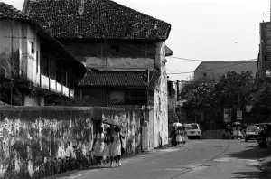 Schoolgirls walking street in old city