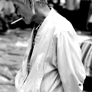 Man hanging around while smoking cigarette
