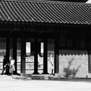 Couple strolling about Gyeongbokgung