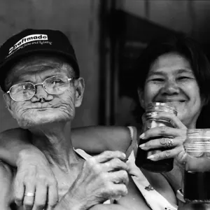 Man and woman drinking alcohol in daytime