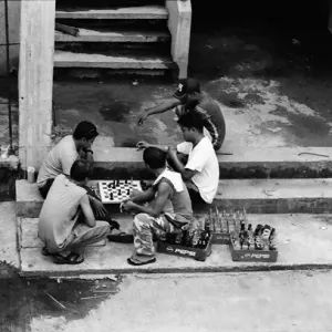 Some men playing chess in market