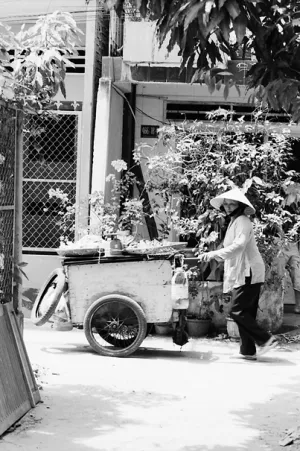 Woman peddling in residential area