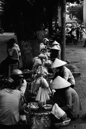 Street vendors wearing conical hat