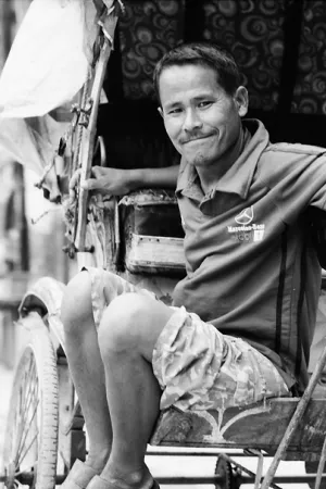 Rickshaw man waiting for customers