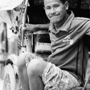 Rickshaw man waiting for customers