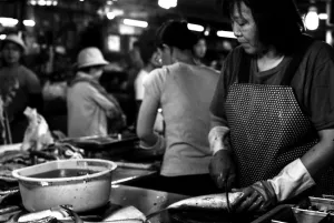 Woman working in fishmonger