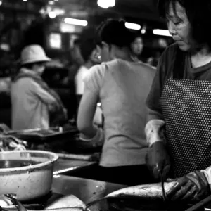 Woman working in fishmonger