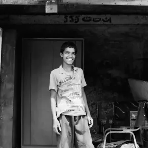 Boy smiling in garage