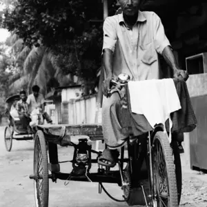Man riding tricycle