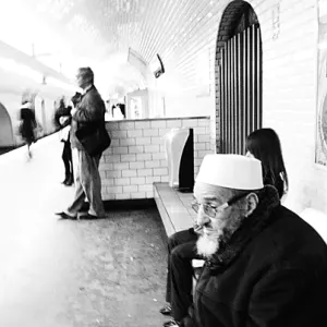 Old man waiting for train