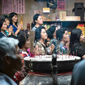 People around incense burner in Shiluodian