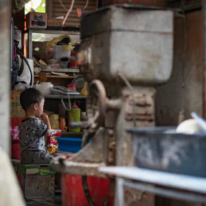 little boy in a shop