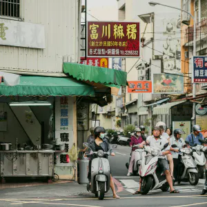 Scooters waiting for traffic light