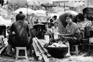 Woman sitting among stalls