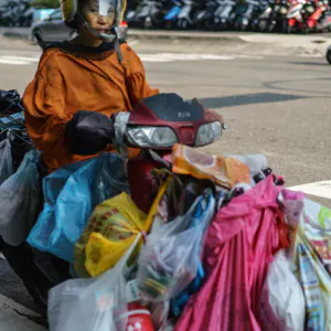 Motorbike with many plastic bag