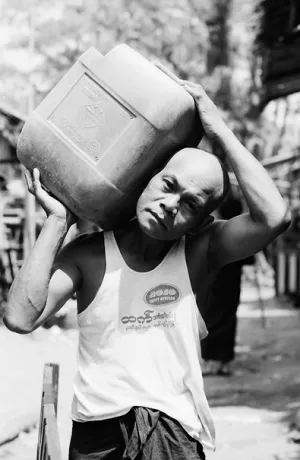 Man carrying container
