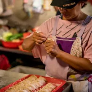 Woman making dumplings in Yamuliao Market