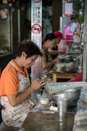Some women making dumplings