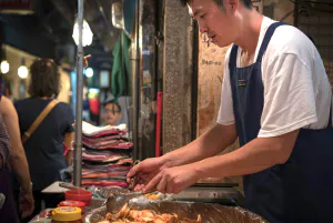 man selling Korean pickle