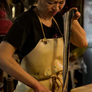 Woman cooking eel