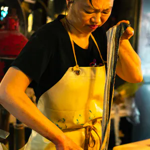 Woman cooking eel