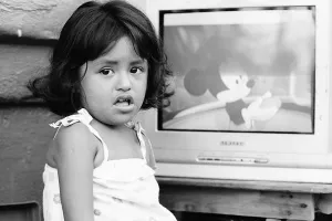 Girl watching animated Disney movie